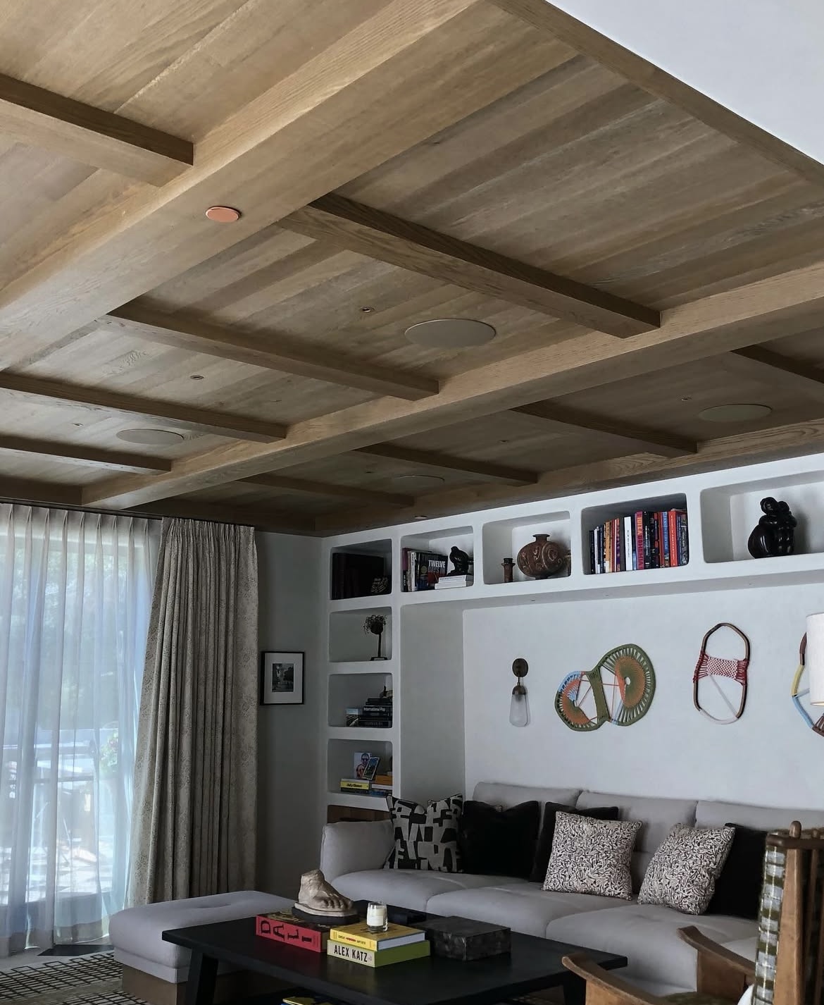 Custom wood coffered ceiling and built-in shelving by Bam Woodworks