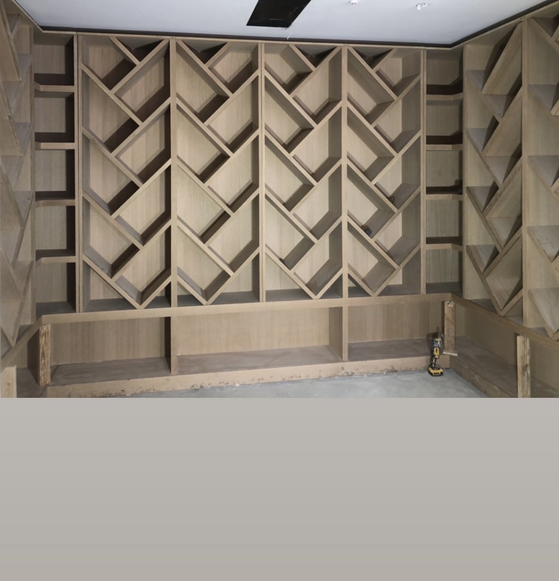 Custom geometric wine cellar shelving