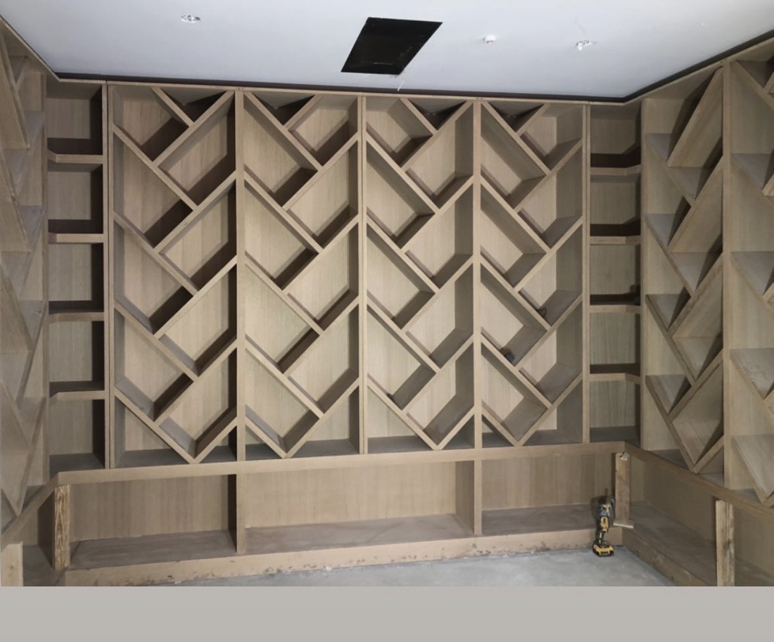 Custom floor-to-ceiling built-in bookshelves San Francisco — white oak with integrated lighting
